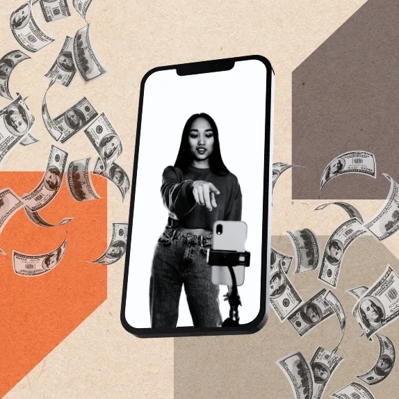 A content creator on a phone screen surrounded by falling hundred-dollar bills